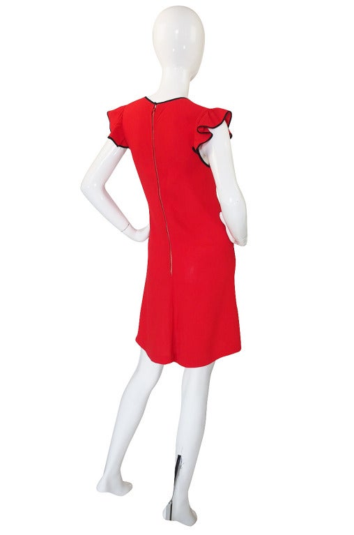 This is the Radley version of the famous cut out dress by Ossie Clark. Ossie oversaw and designed for Radley for a time and during that tenure many of the dresses were simply solid colored versions of his print dresses from his own line. They are