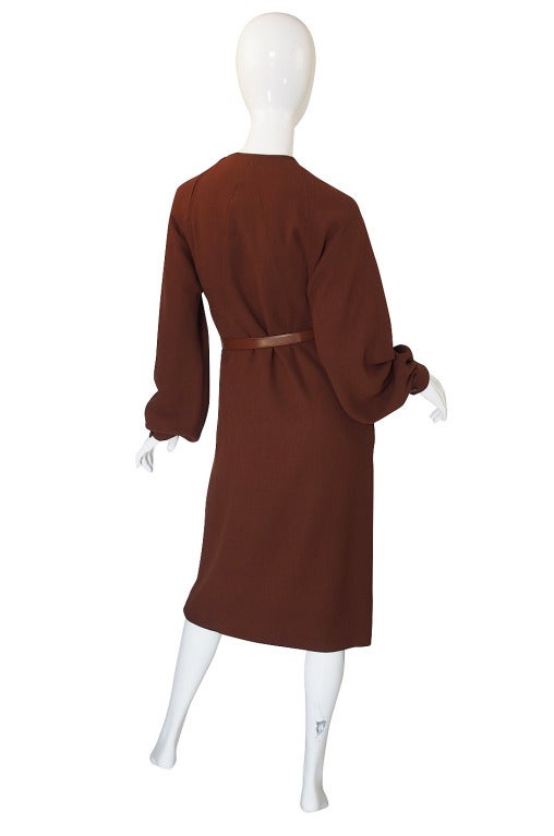 The construction on this dress is to couture levels and quite innovative as well. All the upper seaming is absolute genius and really showcases Galanos gift for tailoring and cut. Made of a fine wool that is a lovely shade of brown  almost a milk