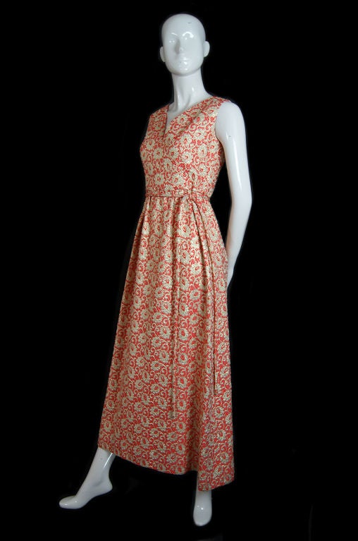 I think this is one of my most favorite pieces. I am a sucker for the dramatic and when you add gold brocade lame and that bright tangerine coral color tot eh mix - well what more can you ask from a dress? The is an amazing piece with one of the