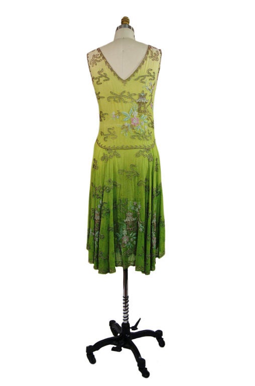 Really unusual 20s dress that is so avant garde I die every time I look at it! Its a silk crepe - cut on the bias in that classic flapper cut - a simple bodice, scooped in the front and back that goes straight into a swingy flippy skirt. This one