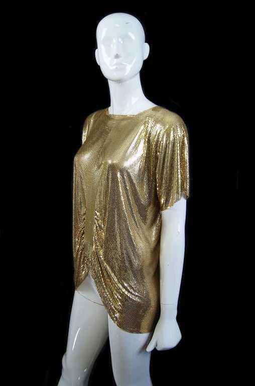 Rare and hard to find piece - this is Whiting and Davis circa 1970! It is made entirely of their signature gold toned metal mesh and the fluidity of it is insane. There is all the tactile experience of wearing this - it's icy cold when you first