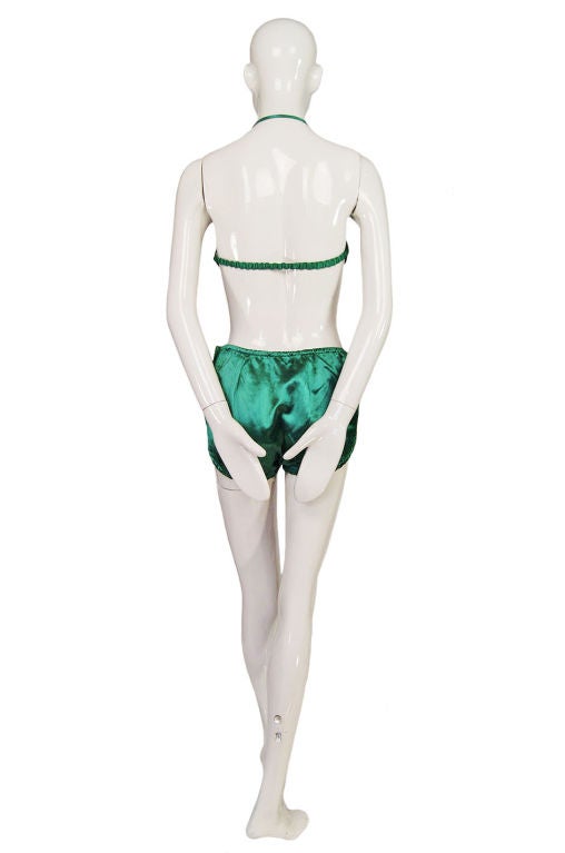 An amazing and rare find - this is a very early two piece bikini pin-up set in a fantastic emerald green satin. From the iconic French company Rasurel, who still makes swimwear even today. This is an exceptional example of early beach wear and it