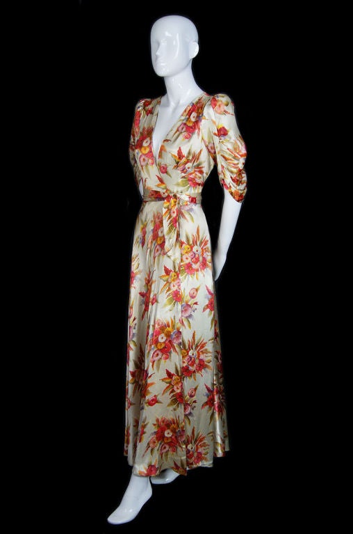 Water color washed floral hand screened print makes this silk satin gown a knock-out. Its a really unusual fabric treatment as most of these are a solid color. It has those beautiful details collectors love in these thirties gowns - it is completely
