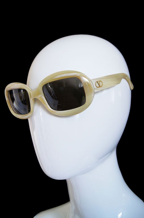 I love these Valentino sunglasses. The frames are handmade and are a type of horn or horn looking resin that has really terrific accents and an interesting depth the the color. They are not crazy huge - rather a more refined lady like size and