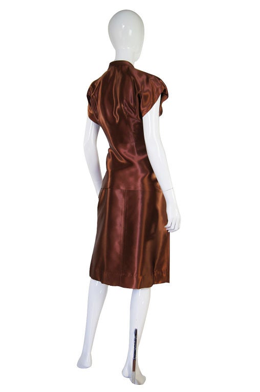 A really special forties suit that is super rare and hard to find! The color is amazing - it's a rich, luxe  copper with an almost deep undertone of pink to it. Made of thick silk satin it is just amazing! You normally see this fabric in gowns that