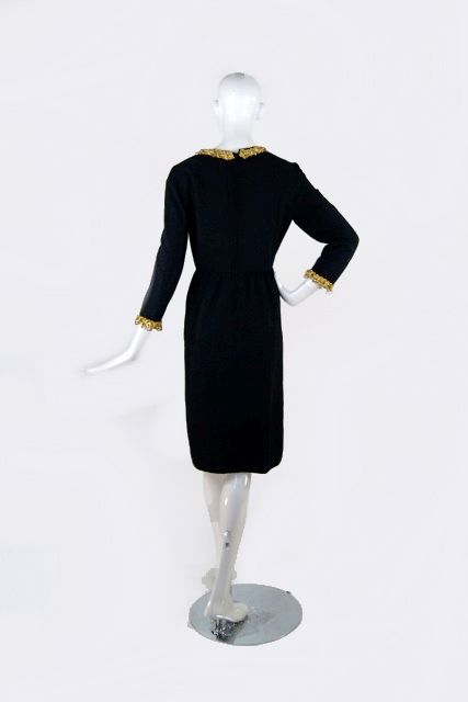 New Price!<br />
<br />
Stunning cocktail dress form the great Oscar De La Renta. Black crepe is fashioned into a classic cut dress with a fitted V neck bodice, long, lean arms and a skirt caught up at the waist with soft gathers. It's ultra