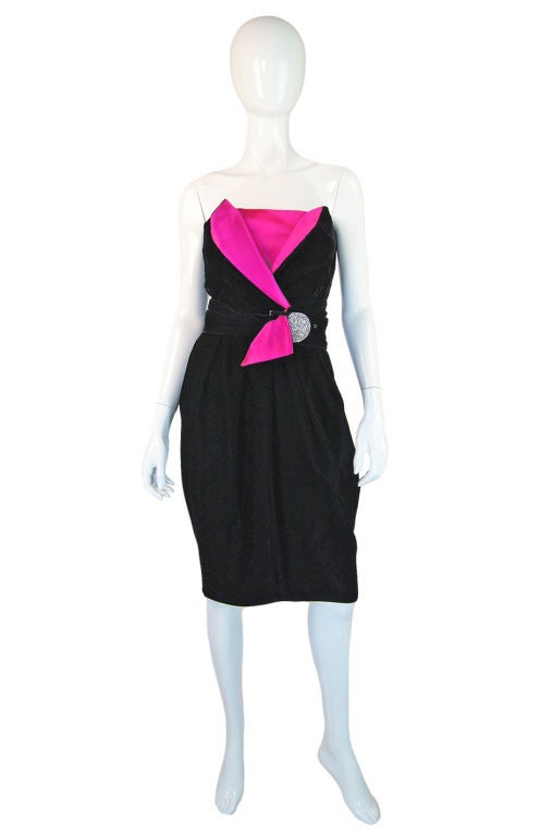 Such a sensual and rich piece - this late 70s Lanvin cocktail dress is just divine! Inky black velvet is used to make the dress with a shocking contrast with the hot pink inset at the bodice for maximum drama. The skirt is a modification between a