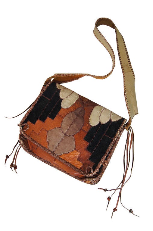 An amazing early Char messenger bag that will add the perfect hippie chic to any outfit! Completely whipstitched and hand applied leather & suede applique are done to create this fantastic and very wearable piece. These almost border on being