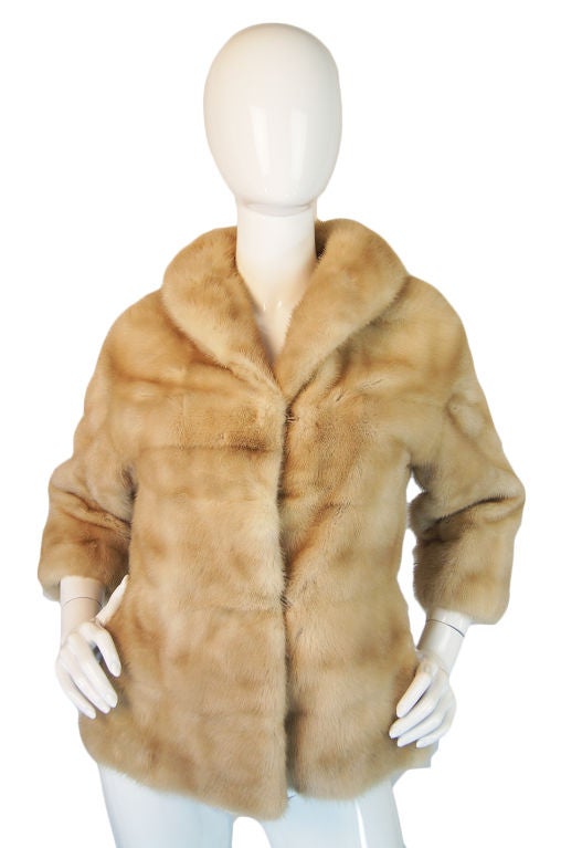 An extraordinary, pale pearl colored mink labeled EMBA Pearl, Natural Pale Beige Mink, Royal Quality. Emba furs were the highest quality furs that one could buy and graced the backs of starlets, royalty and society ladies. It is easy to see that