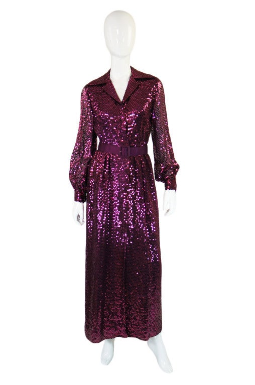 This is am amazing and decadent maxi dress! Every square inch is covered in glossy metallic burgundy, flat round sequins in a weightless silk chiffon base. The body of the piece is lined in hand dyed matching fabric and the entire dress is