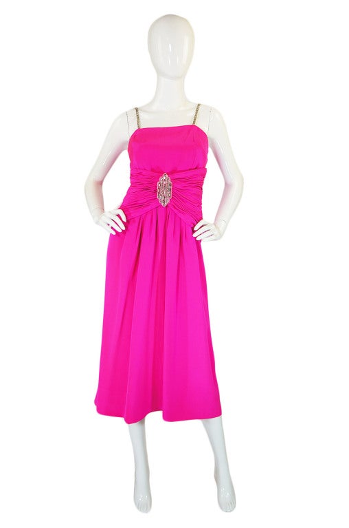 Unbelievable Ted Lapidus Haute Couture dress constructed using a vibrant, bright pink fine silk. Lapidus pieces are rare as it is and to find a piece at this level and this gorgeous is a treat! The dress is extremely well made. Impeccably so. There