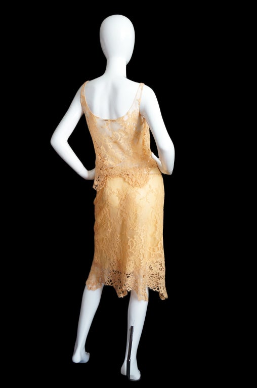 Pieces like this make a girl want to weep with joy! The first thing you must know about this couture quality constructed ensemble is that is literally weighs only a few ounces. It is like holding air. The finest lingerie colored peach lace adds