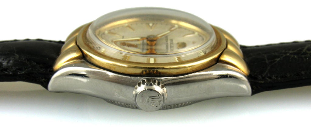 1950's Rolex hooded, boys size bubble back. Stainless steel and 14 karat gold automatic with subsidiary second hand. The watch comes with one year warranty on movement. <br />
Diameter: with crown 32mm