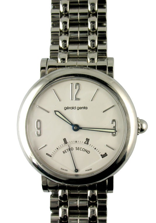 Gerald Genta stainless steel Retro Second. Automatic with deployant bracelet. The watch comes with the box and papers. <br />
Also, a one year warranty on movement.