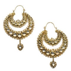 A pair of Indian white sapphire and gold earrings