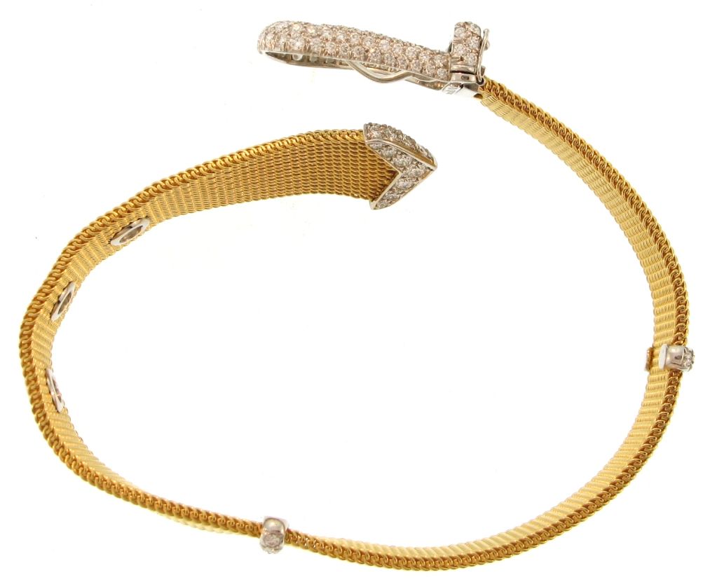 This stunning Retro style bracelet by TIFFANY & CO. features pavéd diamonds set in platinum, a mesh design, in an ADJUSTABLE LENGTH belt buckle design.