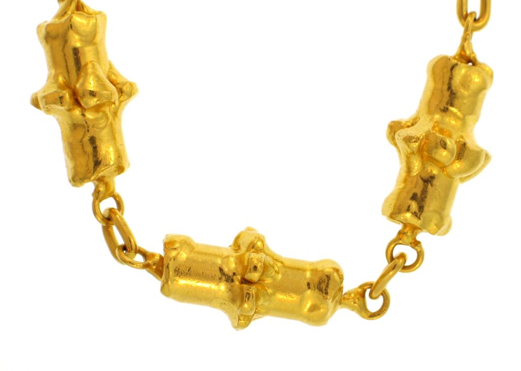 This unique 22k yellow gold necklace by Jean Mahie features 12 solid unusual shaped links. If you like unique, heavy pieces, this is right up your alley. It's 18