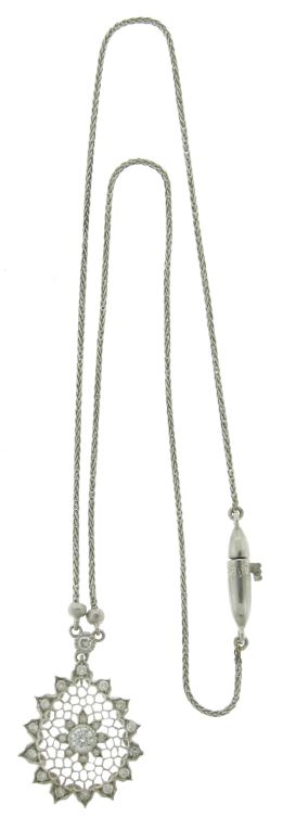 This a beautifully delicate necklace illustrating M. BUCCELLATI'S classic pierced honeycomb design with diamond accents.