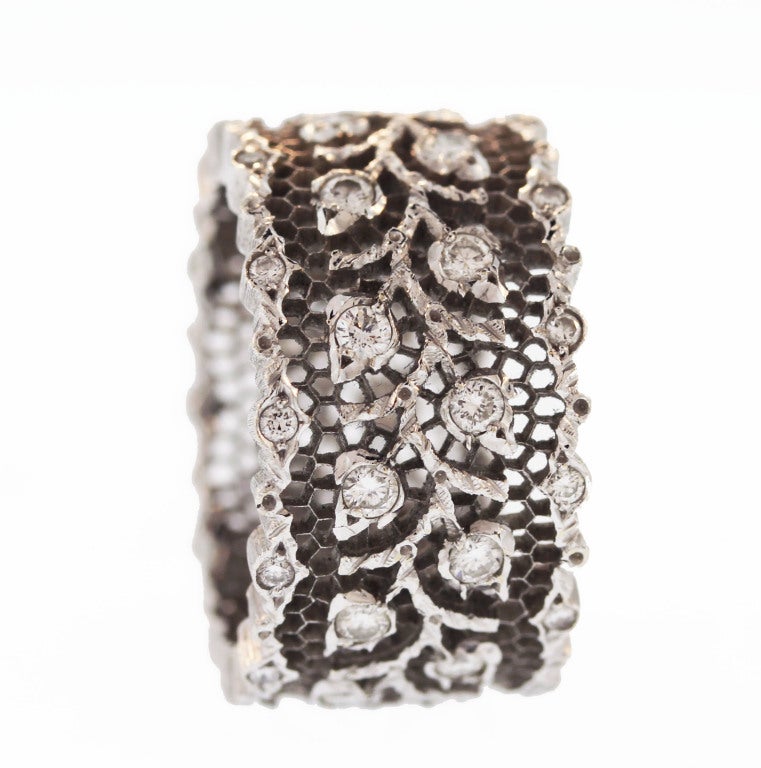 Hand made by the Italian jewelry firm Buccellati, this ring features the famous 