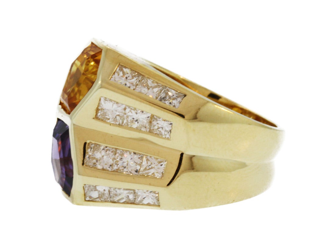 This chunky gold ring features two fancy cut sapphires of purple and yellow color weighing a total of approximately 10.00 carats further accented by princess-cut diamonds.  A bold ring of unusual color and quality.