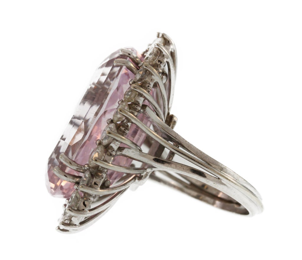 This fun cocktail ring features an very large oval kunzite weighing approximately 30.00 carats framed by round diamonds.  The soft clear pink color of this stone and its significant size make this a great conversation piece.