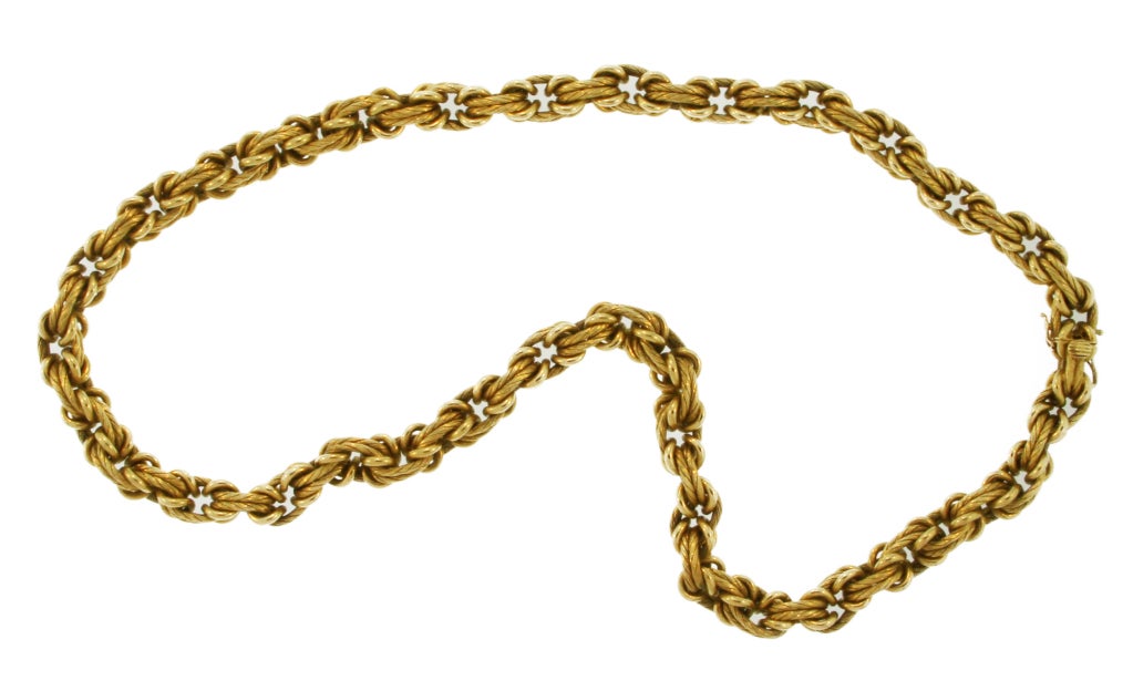 This beautiful gold link necklace features various textured gold links of twisted and polished design.  Made by Tiffany & Co., this necklace comes with the appraisal from Tiffany & Co. from 1987.