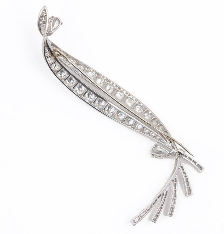 Platinum and diamond brooch, designed as a stylized leaf set with pear-shaped diamonds weighing approximately 1.25 carats, baguette diamonds weighing approximately 1.00 carat, and round and single-cut diamonds weighing approximately 7.50 carats,