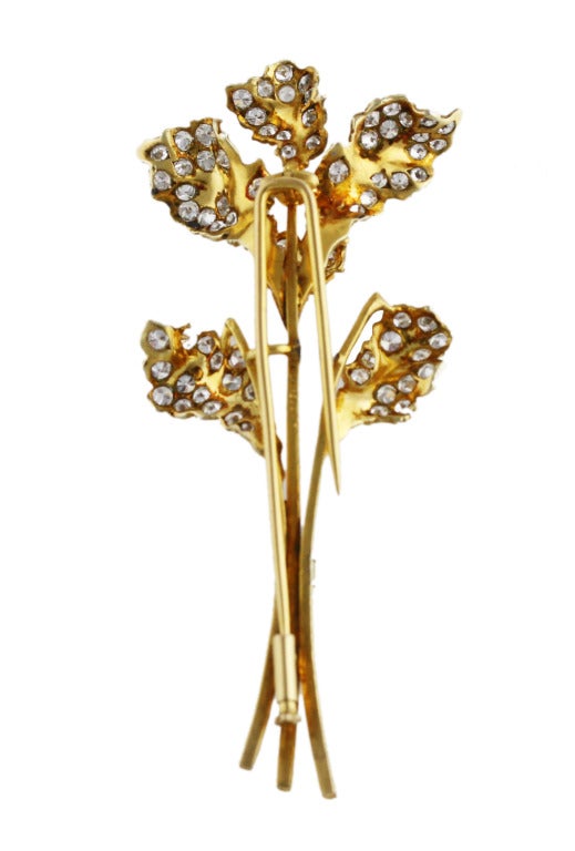 18 karat yellow gold and diamond leaf pin by Buccellati, the petals set with 78 round diamonds weighing approximately 3.50 carats, gross weight 14.9 grams, measuring 3 by 1 1/4 by 5/8 inches, signed Buccellati.