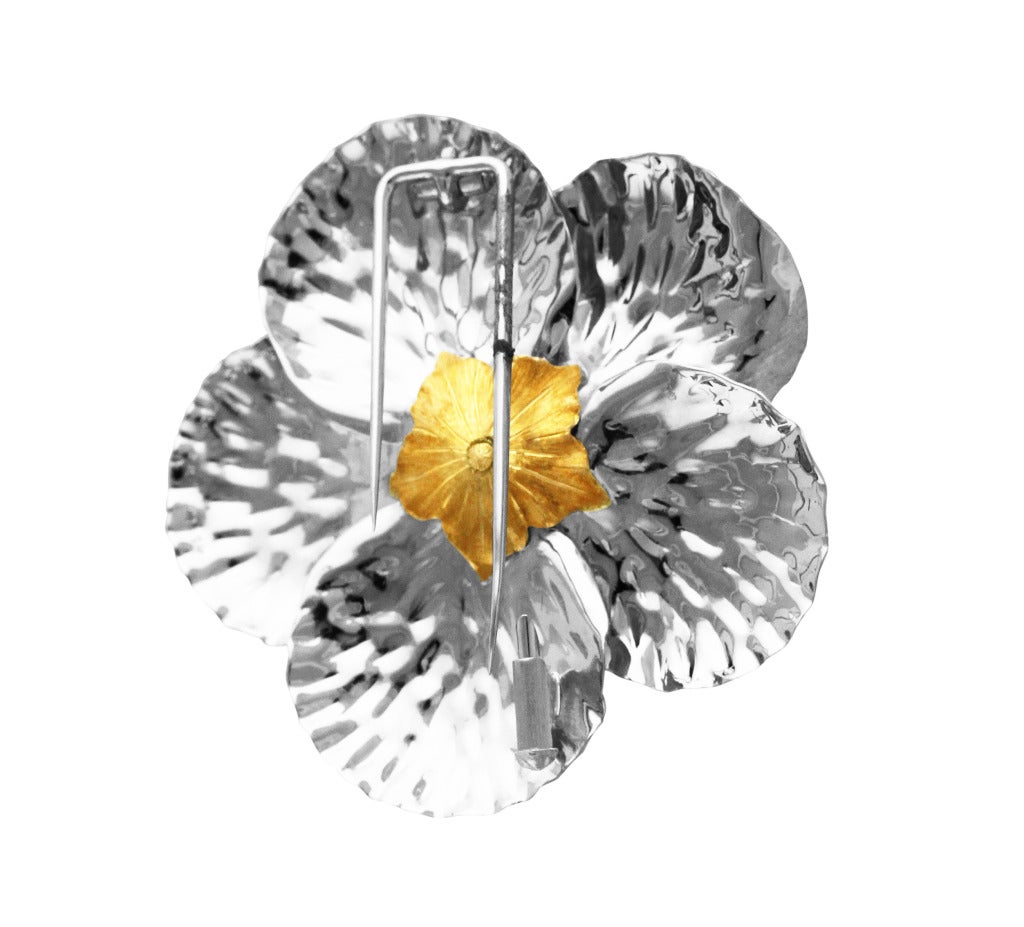 18 karat white and yellow gold 'Magnolia' brooch by Buccellati, designed as a magnolia flowerhead composed of textured yellow and white gold, gross weight 13.8 grams, measuring 1 7/8 by 1 7/8 by 1/2 inches, signed Buccellati, Italy, numbered No.