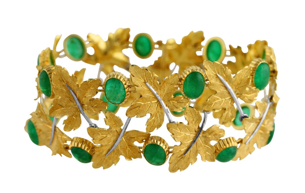 A naturalistic 18k yellow gold and emerald bracelet by Buccellati, the highly flexible band of foliate design composed of eighteen textured gold leaves, spaced by 18 cabochon emeralds weighing approximately 27.00 carats, gross weight 42.5 grams,