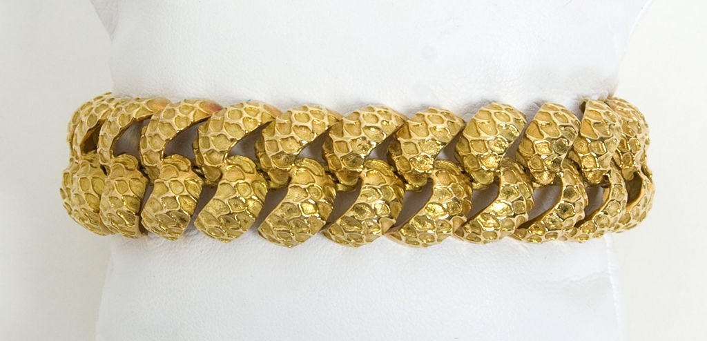 Unusually textured eighteen karat gold bracelet. Signed RS; measures 7