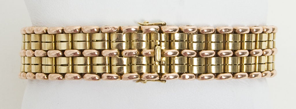 Tailored pink and yellow fourteen karat gold Retro bracelet that is substantial enough to be worn alone or combined easily with other bracelets.<br />
Measures 7 1/4