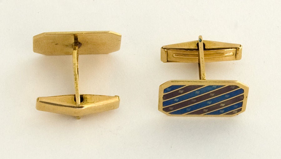 Enamel on eighteen karat gold cufflinks. Blue and mauve diagonal stripes are lighter in color than appear on my monitor. Probably European origin; circa 1950.