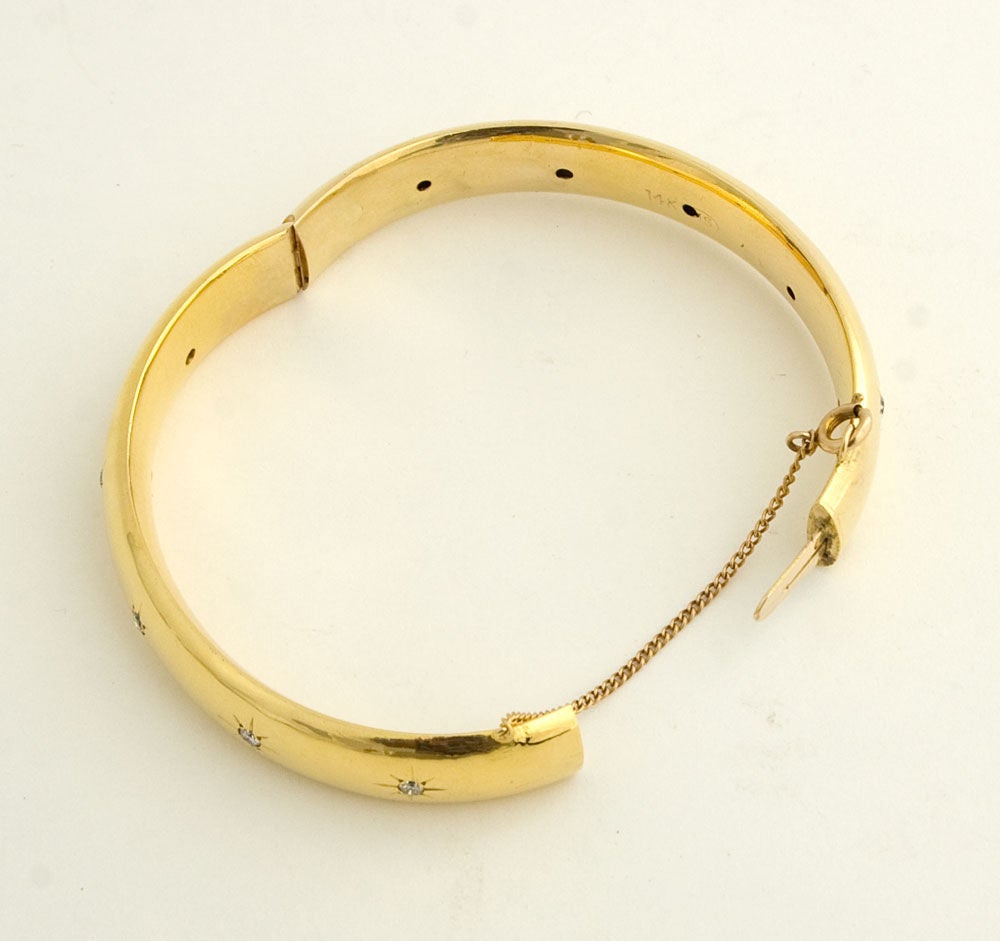 gold bangle with diamonds inset
