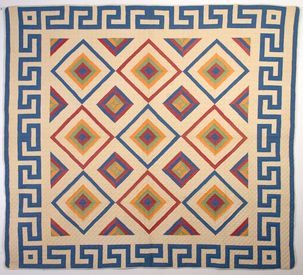Diamonds within diamonds most resemble the Eye of God design in this unusual quilt pattern. The Greek Key is a brilliant choice of border for this bold design. <br />
The most surprising aspect of this quilt is that it is made entirely of 1 1/2
