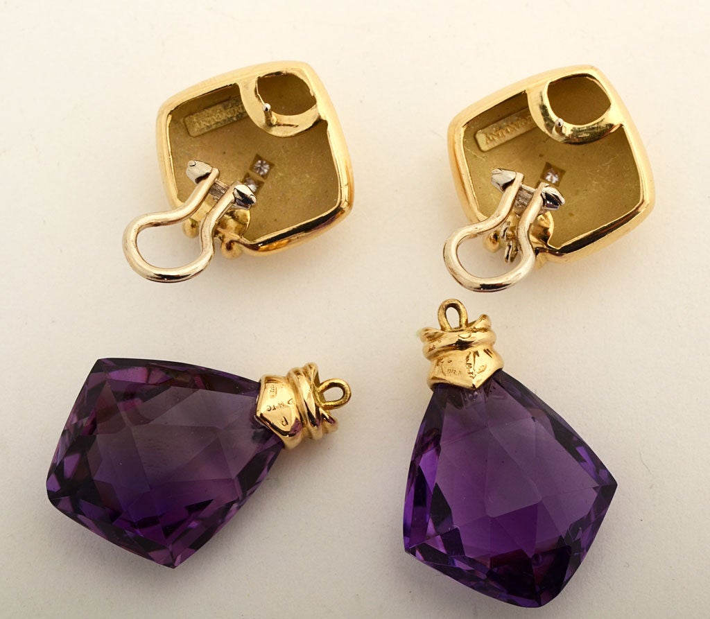 These elegant gold, amethyst and diamond earrings can be worn equally well in two different ways. The large amethyst drop is removable to have a diamond shaped gold earring, each with five diamonds. They measure 2