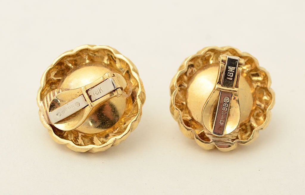 Hammered gold rope surrounds large mabe pearls in these classic earrings by David Webb. They measure 1