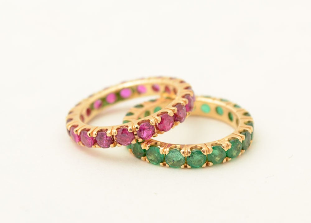 This is a pair of nicely colored emerald and ruby eternity bands. They are size 4 and date to the 1950's.