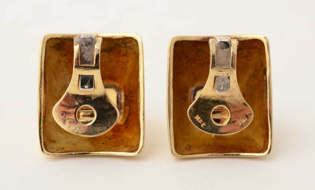 These very large, gold and citrine earrings are unusually streamlined for New York designer, Marilyn Cooperman. Cooperman designed for Madison Avenue jeweler, Fred Leighton and in 1994, began working on her own. Her work is well known to