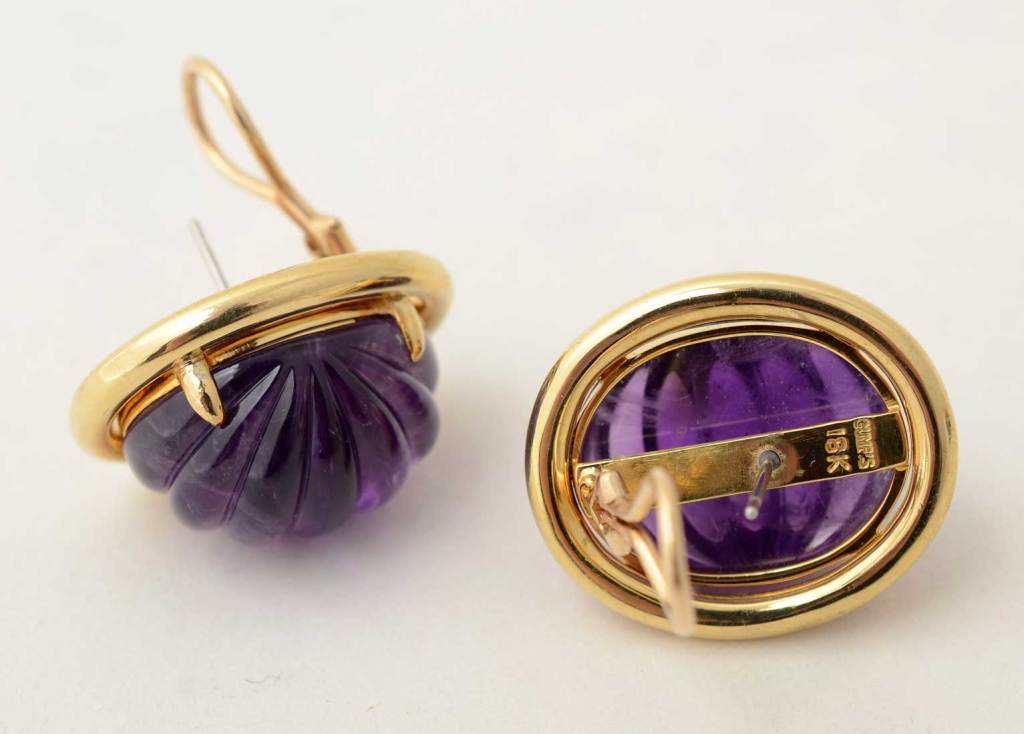 Chunky carved amethyst earrings by Gump's of San Francisco. The beautifully colored stones are set in oval bands of 18 karat gold. Omega backs.