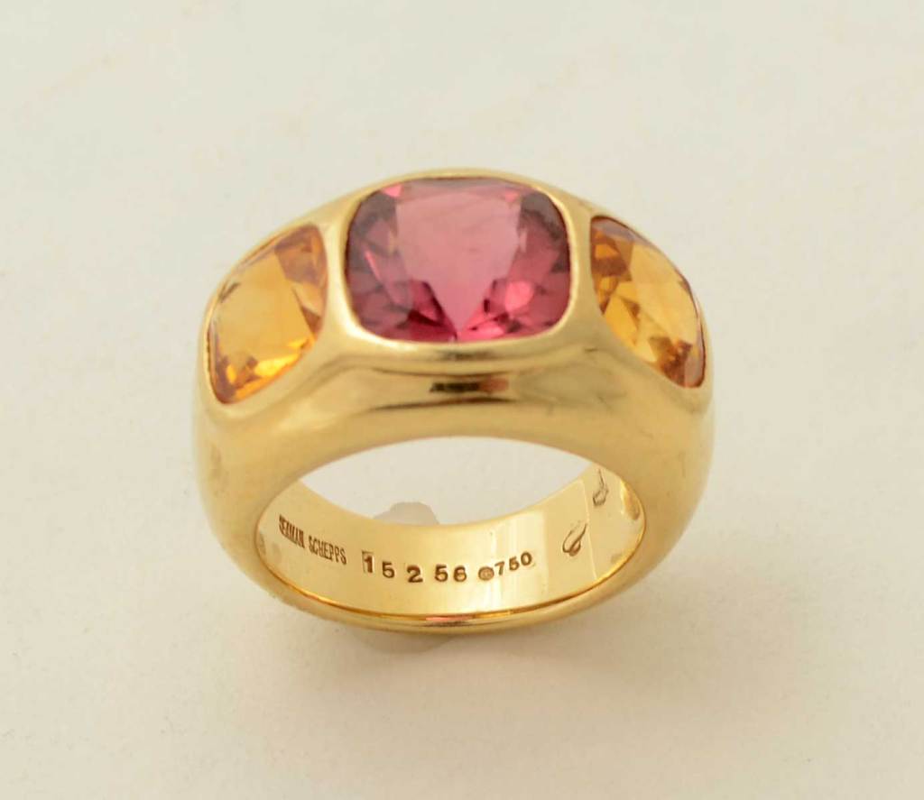 Wonderfully chunky gypsy ring by Seaman Schepps. The central stone is pink tourmaline with a citrine on either side. It is size 6 1/2 but can easily be sized.