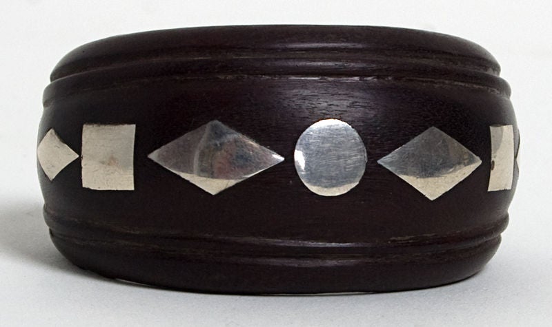 Ebony wood and sterling silver cuff bracelet by silver master, William Spratling. Fits a small/medium wrist. Wood is 1 1/2