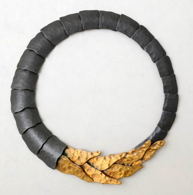 Stunning and unusual necklace by architect turned jeweler, Eduardo Herrera. Blackened oxidized silver is combined with an ancient alloy of gold and copper. The two colors, combined with two shapes of links make for a dramatic and unusual statement.