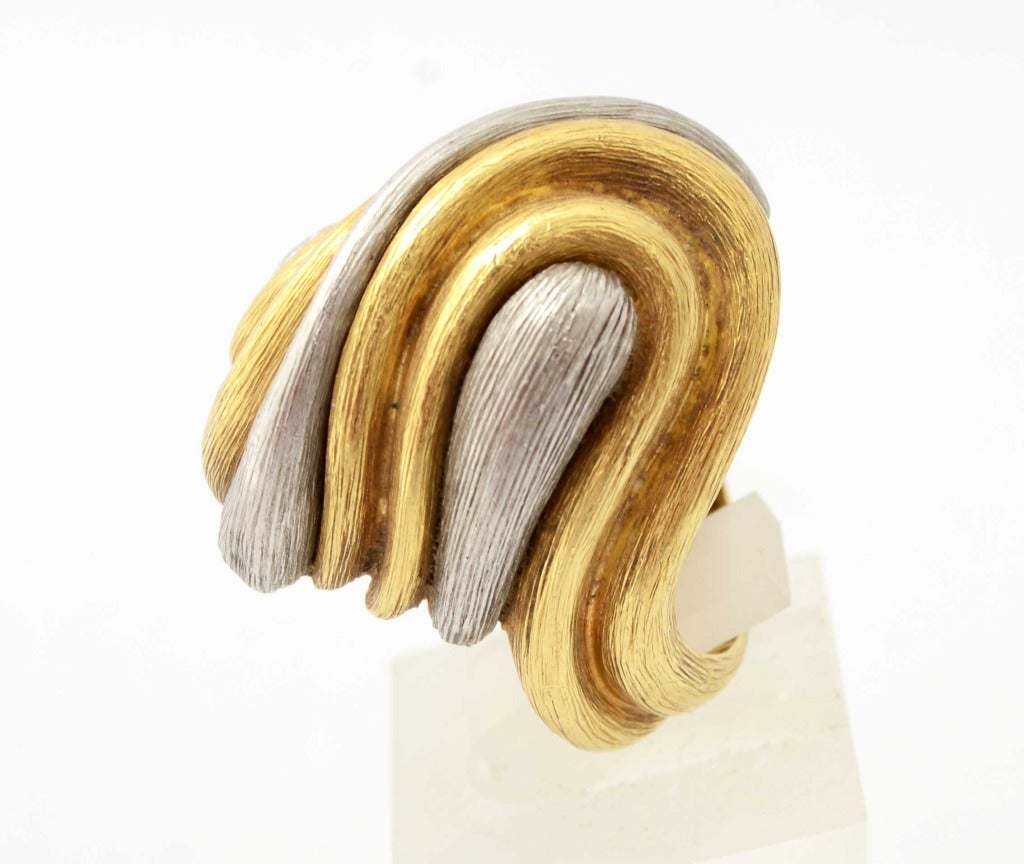 This very large, undulating domed ring by Henry Dunay is from his Sabi collection which combines 18 karat gold and platinum. Both metals have a hand textured finish. The ring is size 7 3/4 but can be sized up or down. The top measures 1 1/2