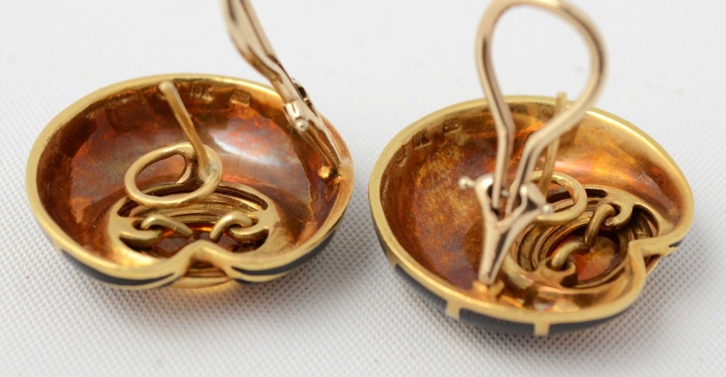 Unusual earrings combining citrine with gold and enamel. Oval citrines are in three tiered settings. Earrings are 1