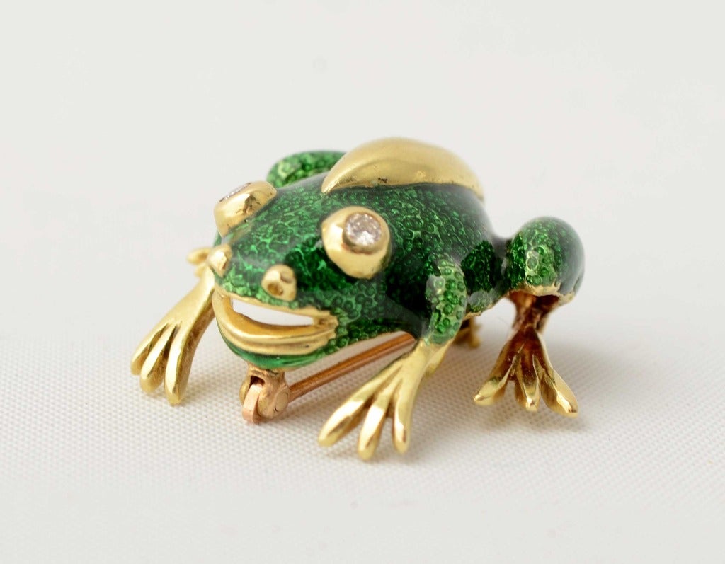Whimsical frog brooch by Tiffany with green enamel and diamond eyes. Measures 1 1/16