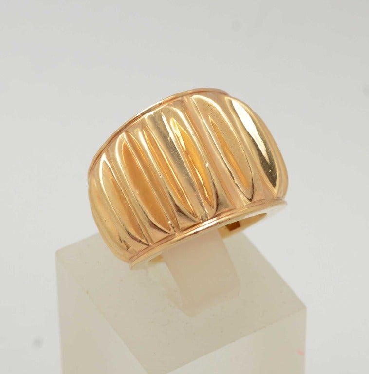 Heavy weight ribbed gold ring by Seaman Schepps. Measures 11/16