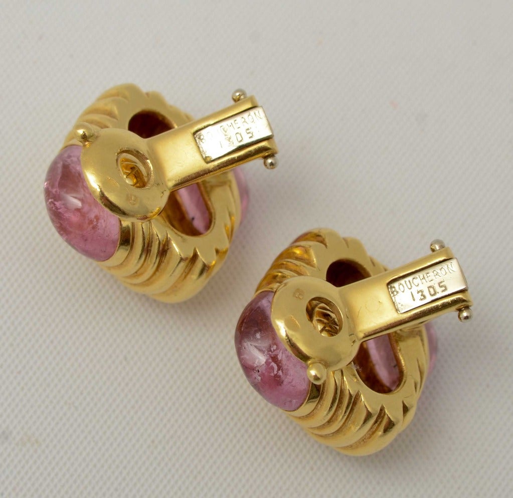 Ribbed gold earrings by Boucheron with pink sapphires top and bottom. Measurements are 1