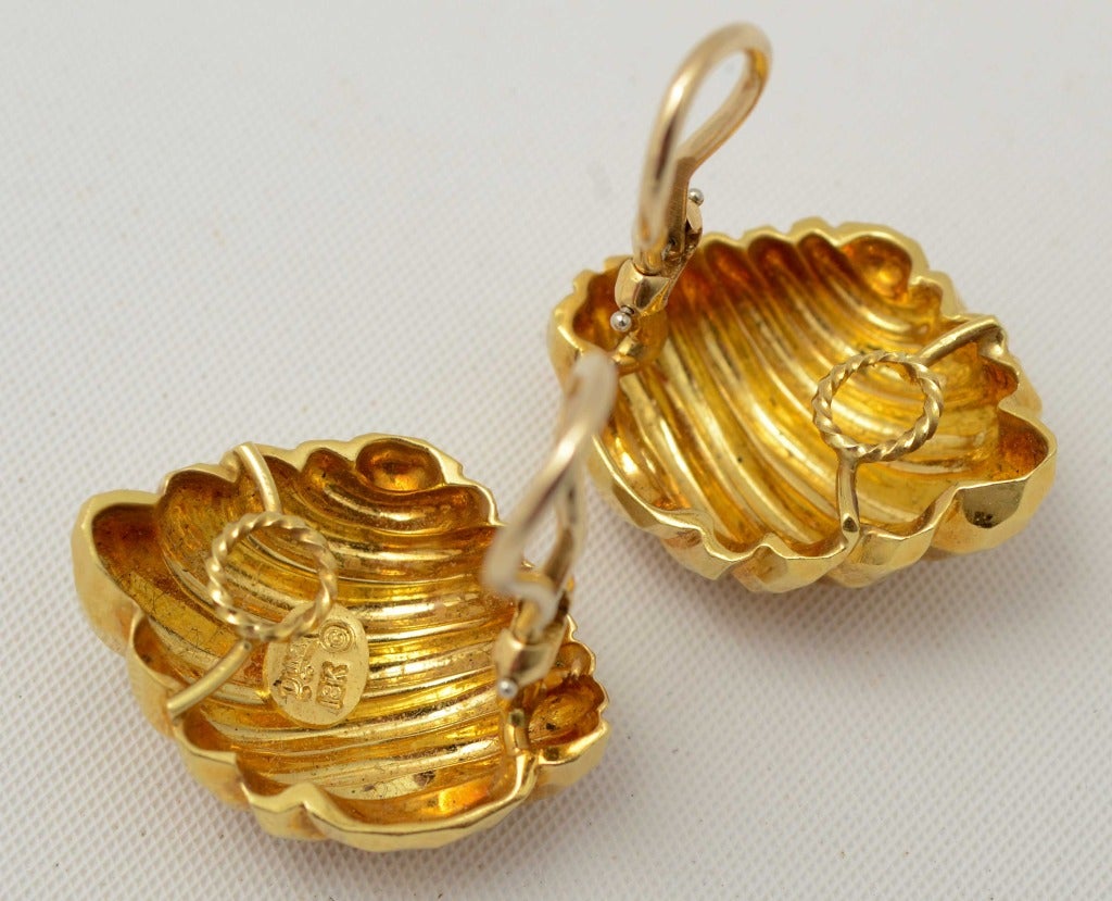 Hammered eighteen karat gold earrings by Henry Dunay with a nice swirl to the overall design. Clip backs can be converted to posts. Measure 1