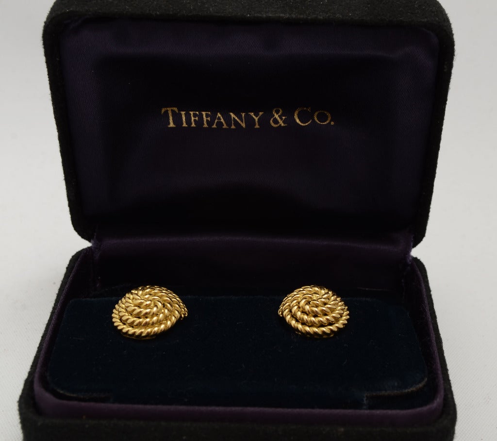 Lovely coiled earrings of gold rope by Tiffany. Made of 18 karat gold; measure 1/2
